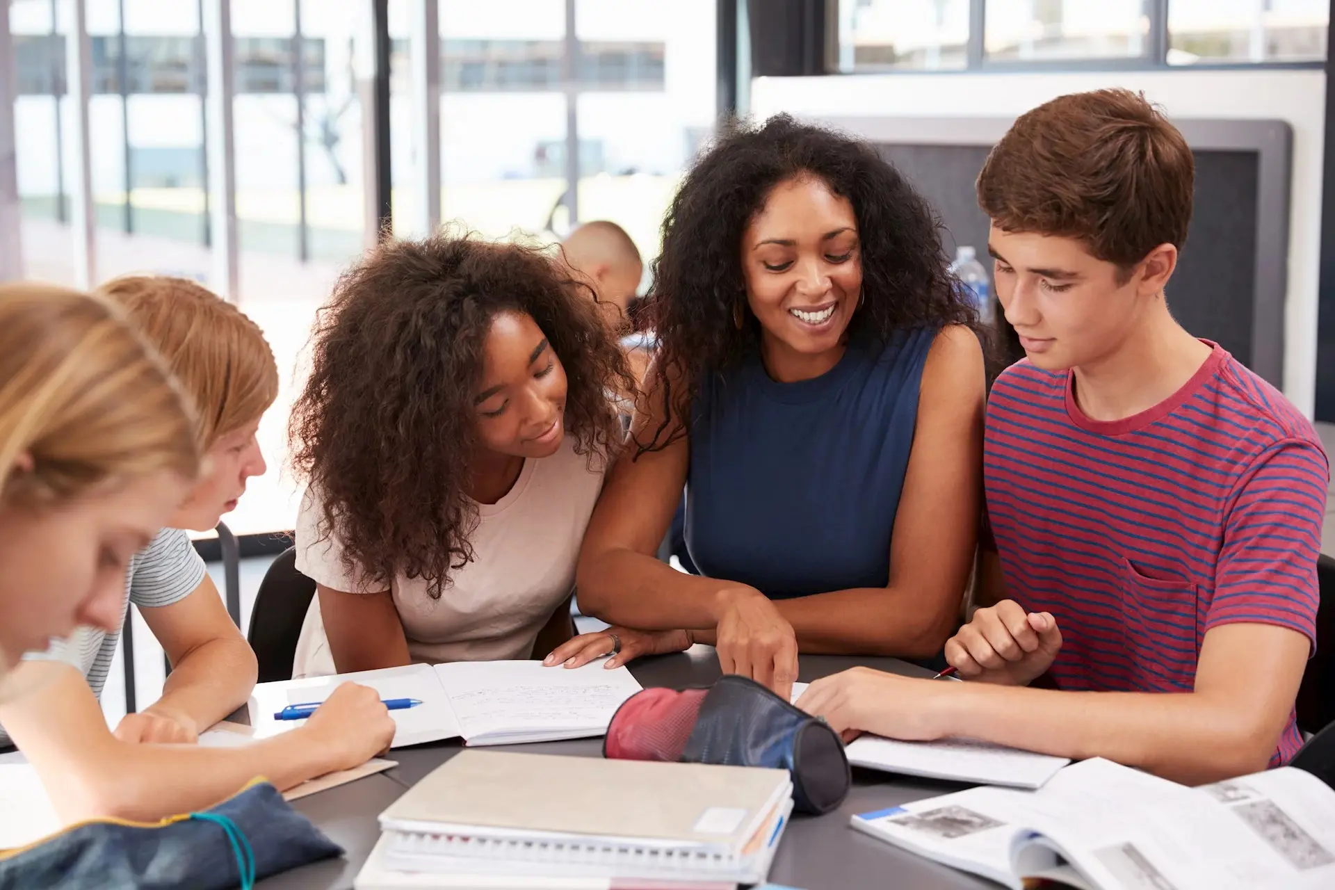 A black educator tutoring students