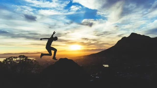 Guyjumpingonmountain_2023